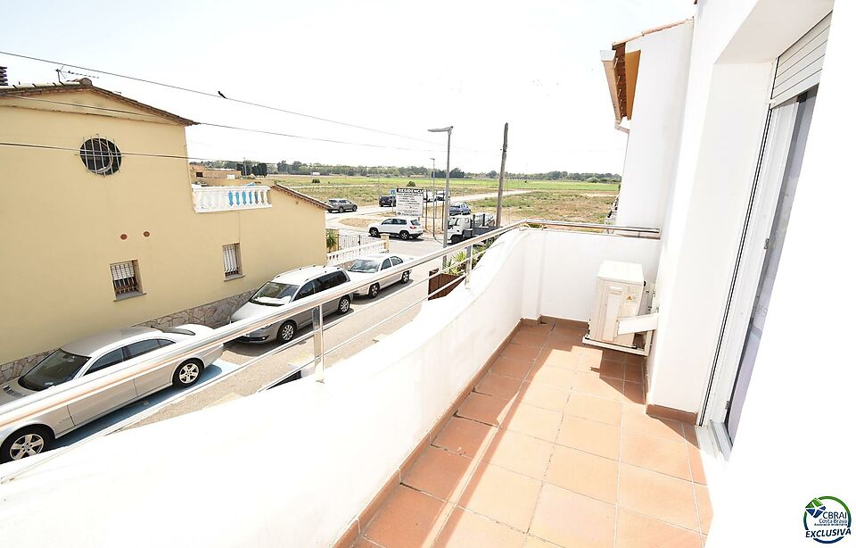 EMPURIABRAVA: New house with two bedrooms, patio, and garage for sale
